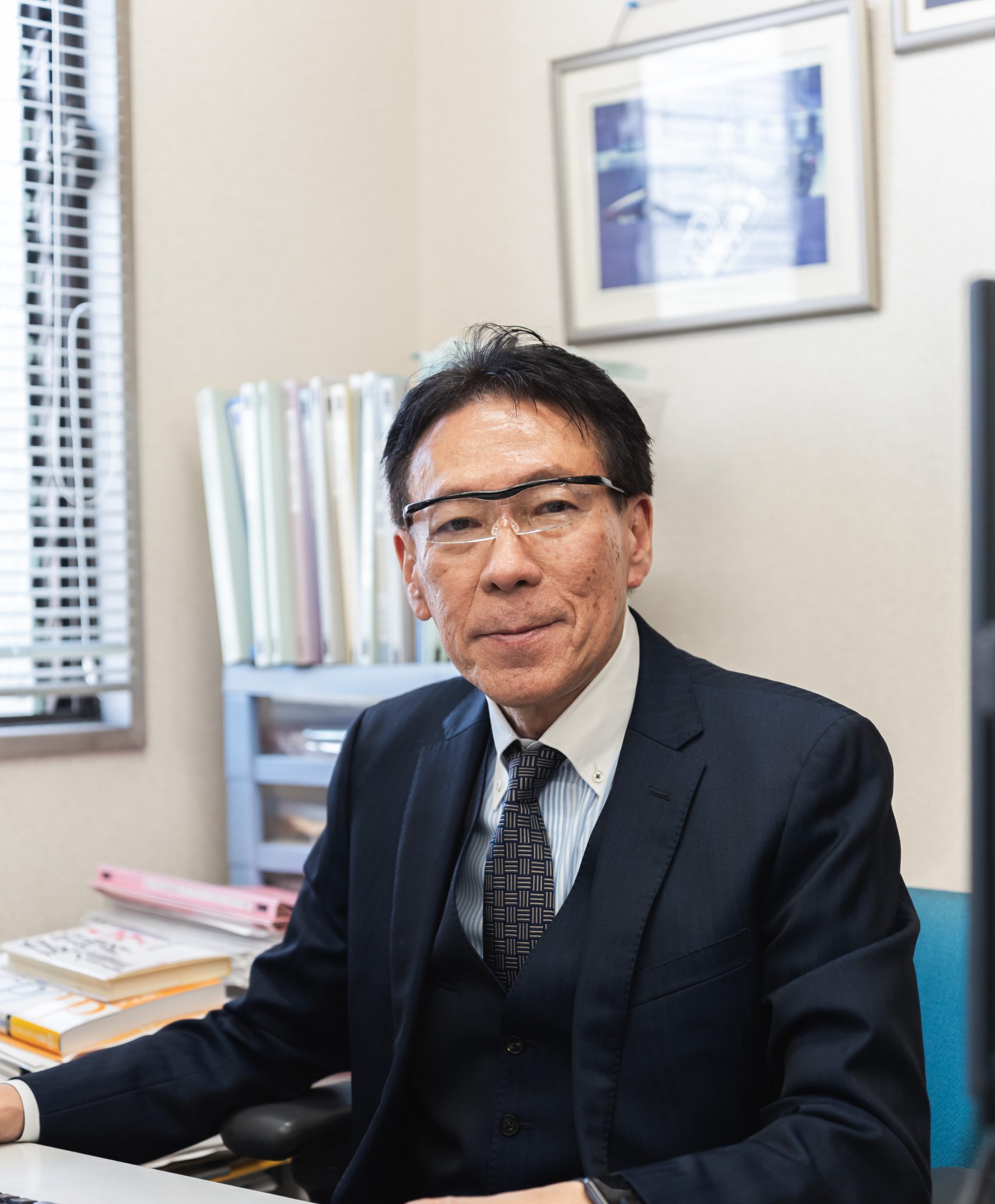 微笑む前田守会長